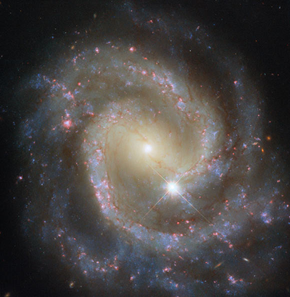 This Hubble image shows NGC 3507, a barred spiral galaxy located 46 million light-years away in the constellation of Leo. Image credit: NASA / ESA / Hubble / D. Thilker.